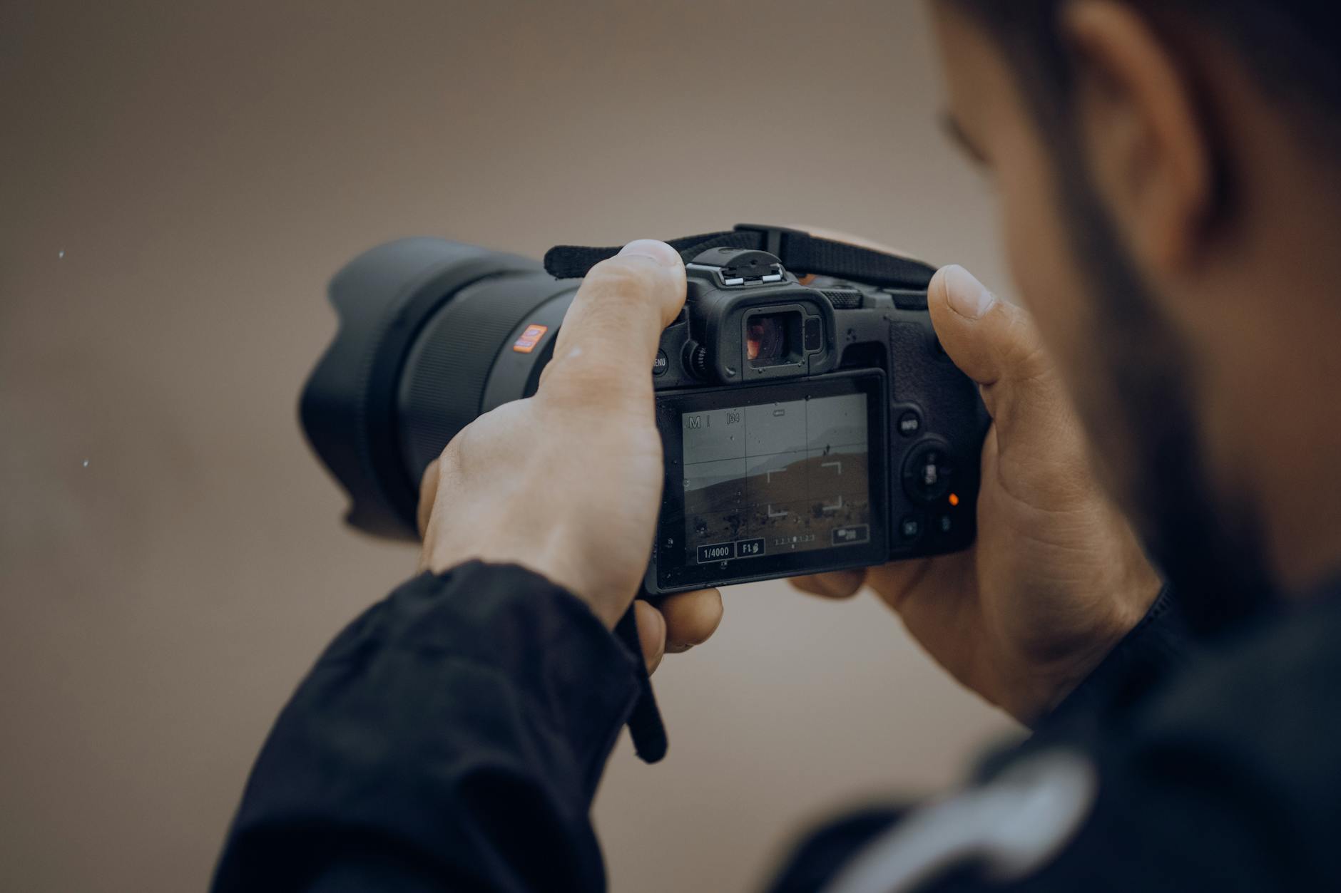 A man is taking a picture with his camera