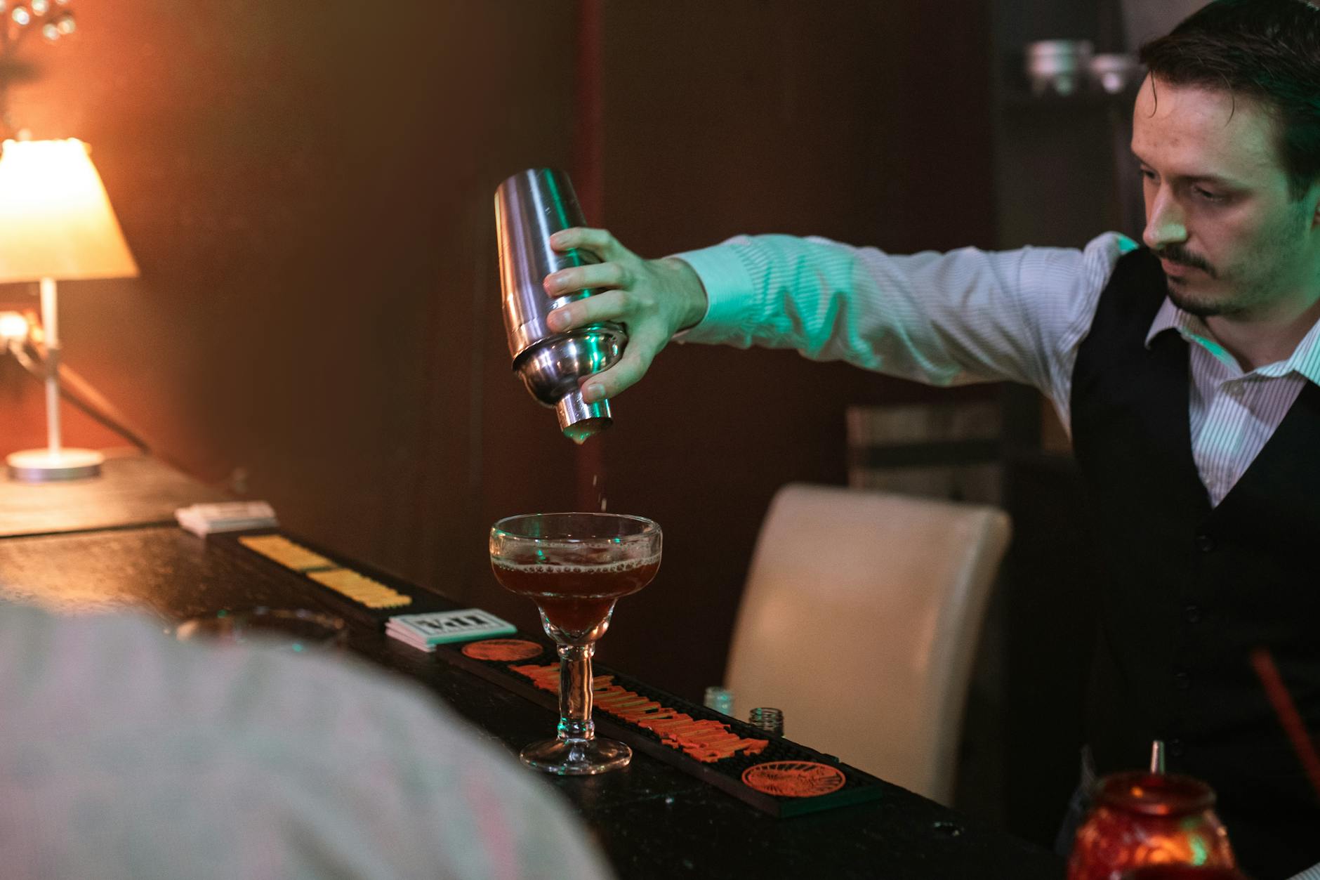 A Bartender Making a Cocktail Drink