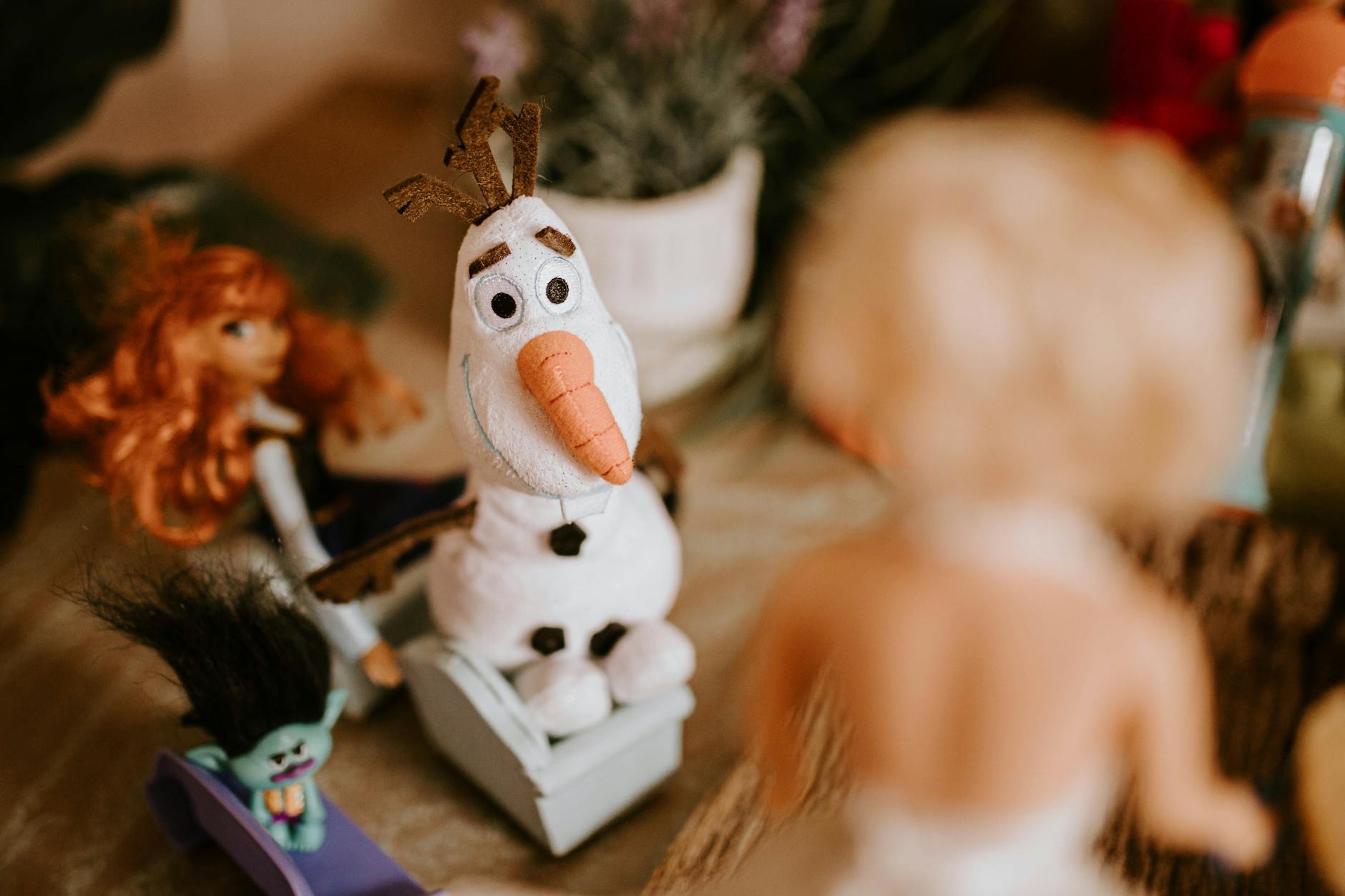 High angle of small toys in role of guests on romantic wedding ceremony of dolls