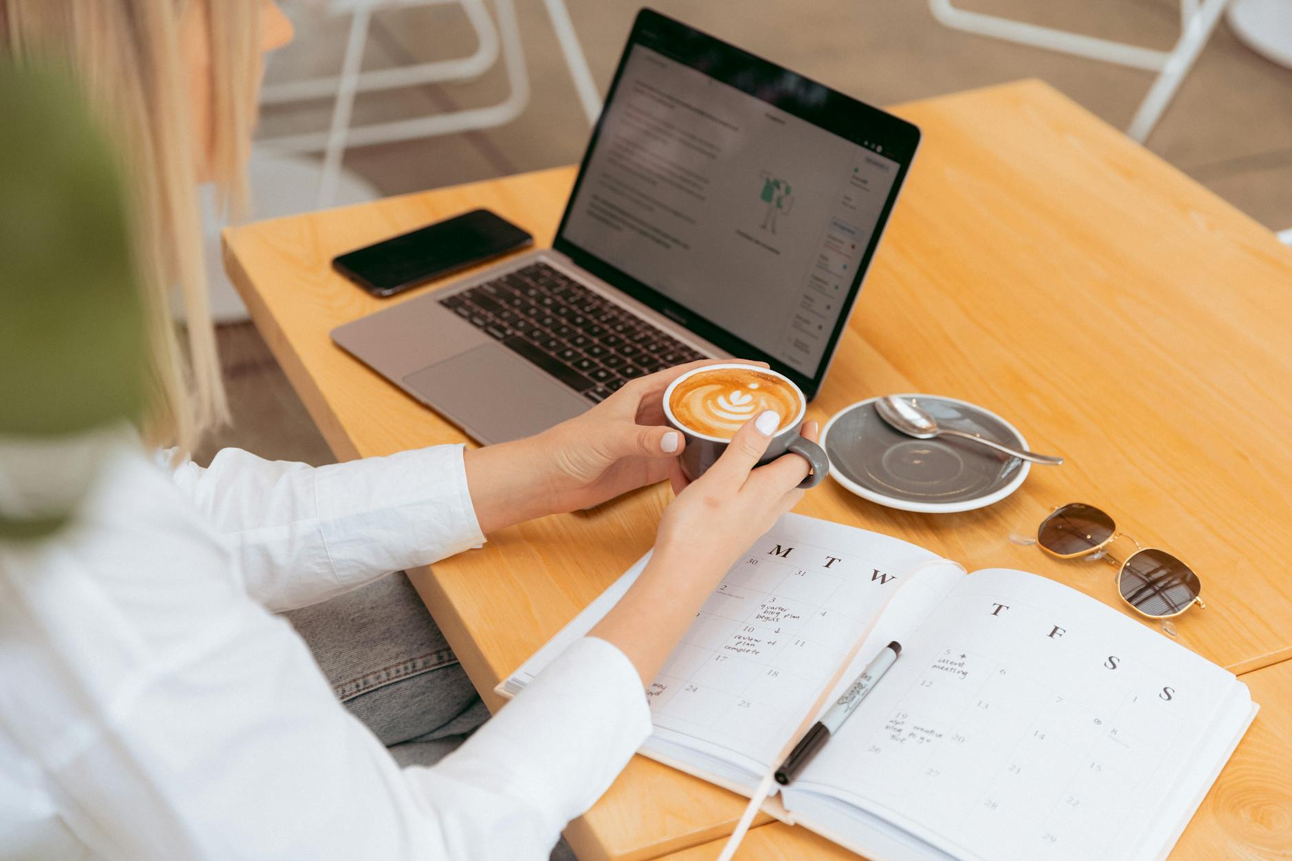 Young Woman Planning Her Schedule with Coffee