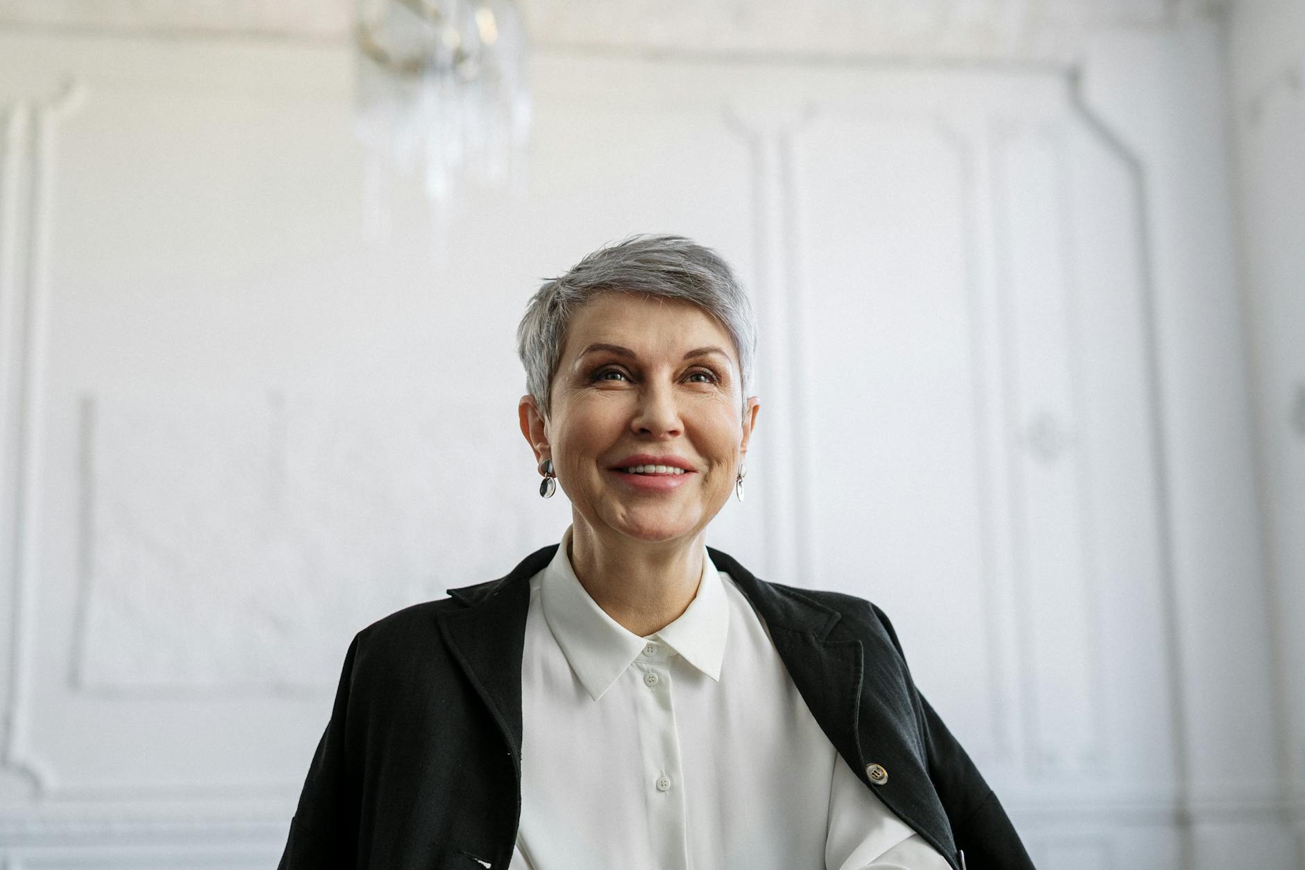 Smiling Woman in Black Blazer