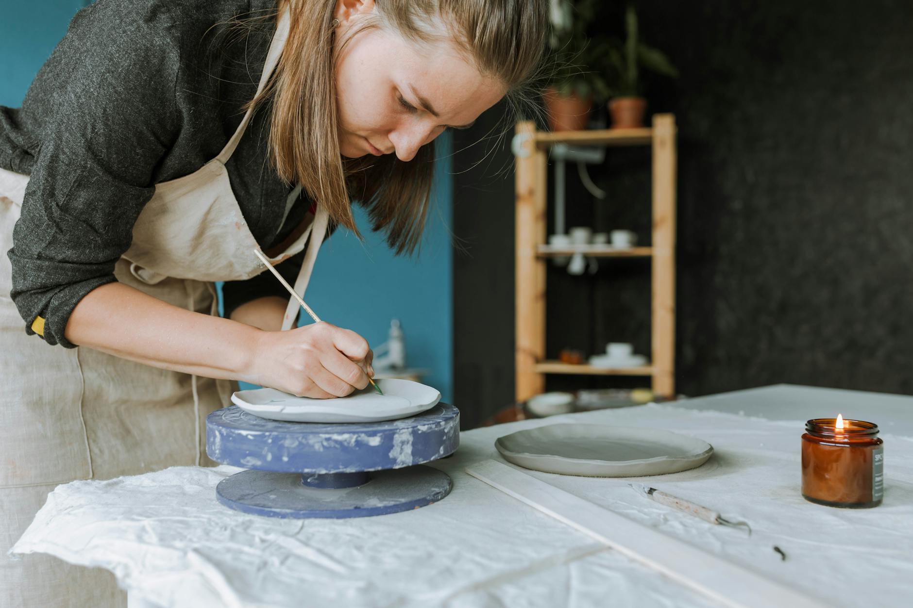 Woman Painting on Clay