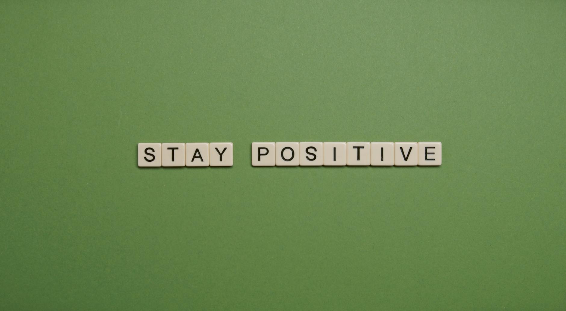 Stay Positive Text on Green Background