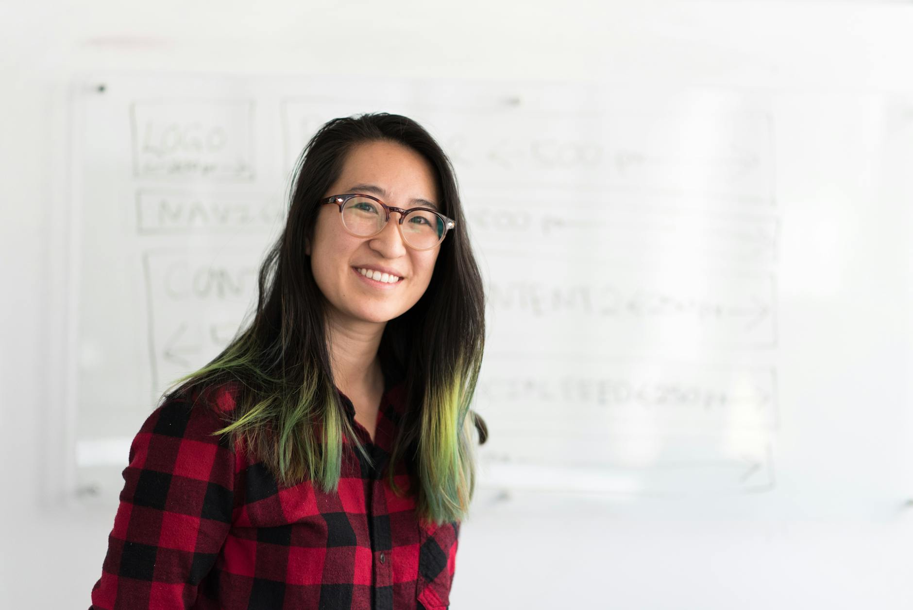 Woman Standing in Front of Whiteboard