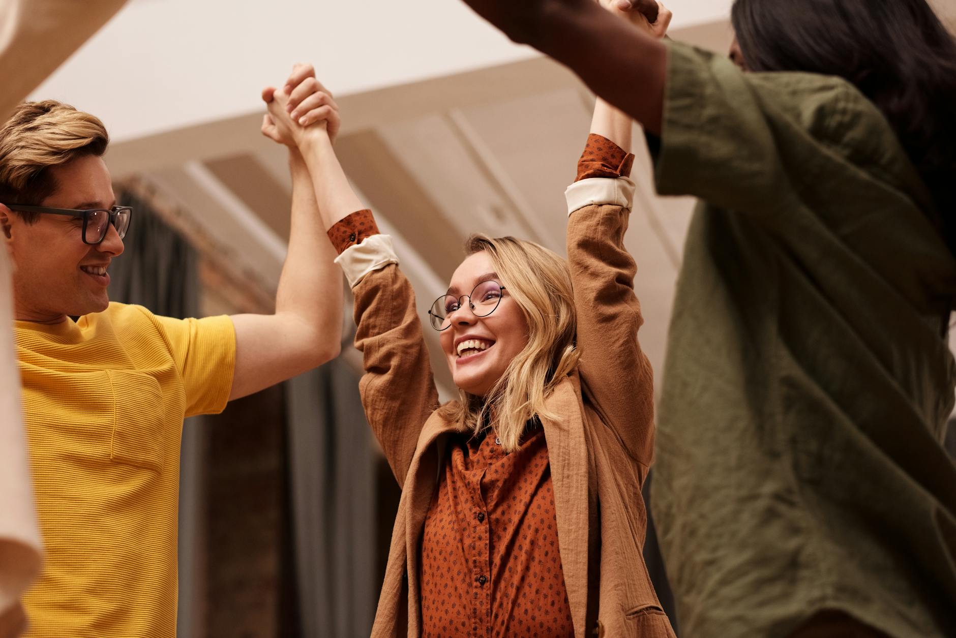 Group of People Holding Their Hands Up