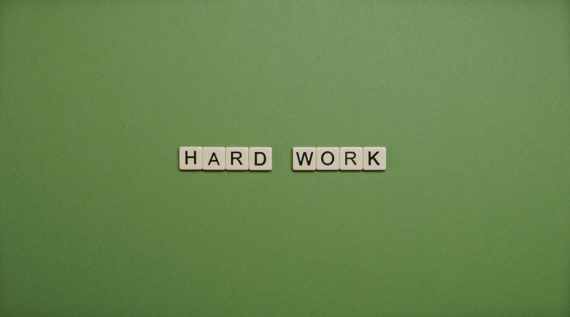 Hard Work Text On Green Background