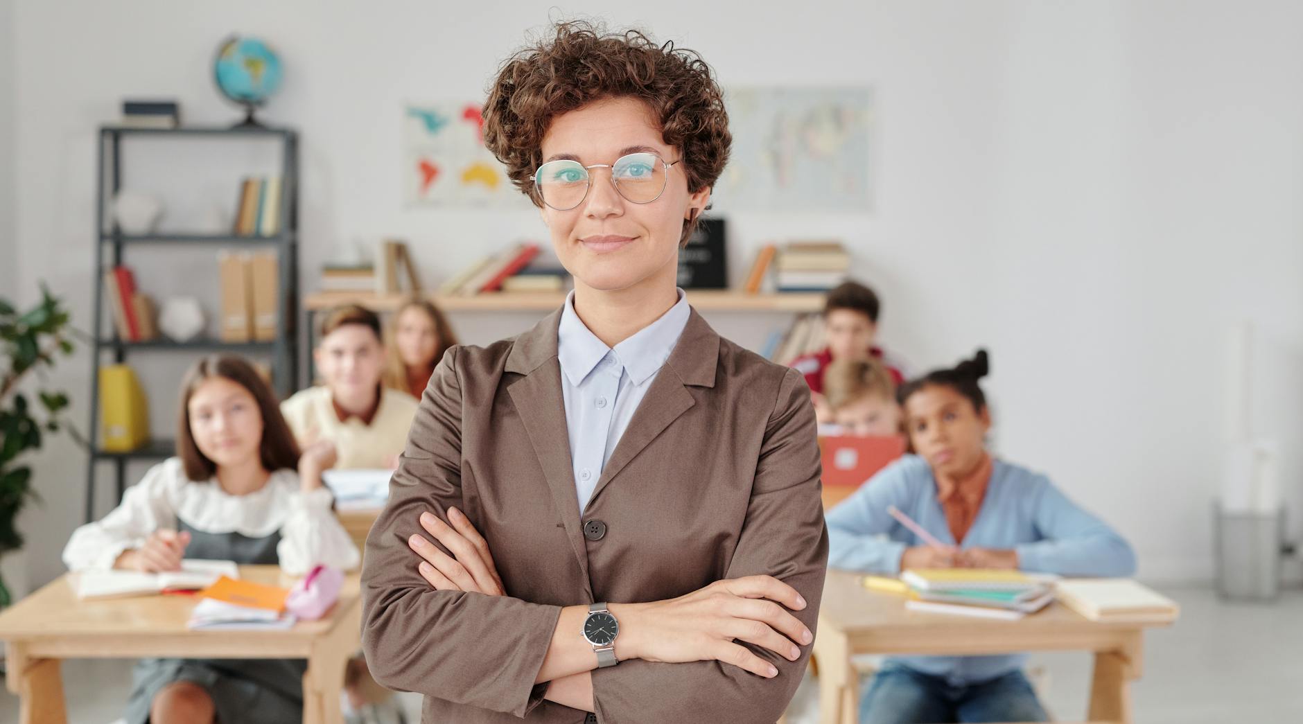 Woman in Brown Blazer Wearing Eyeglasses