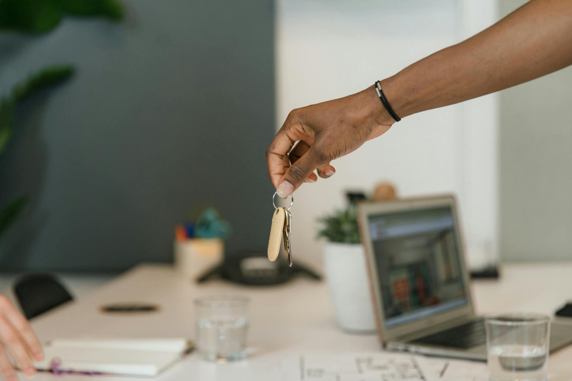 Person Handling Keys in Office 