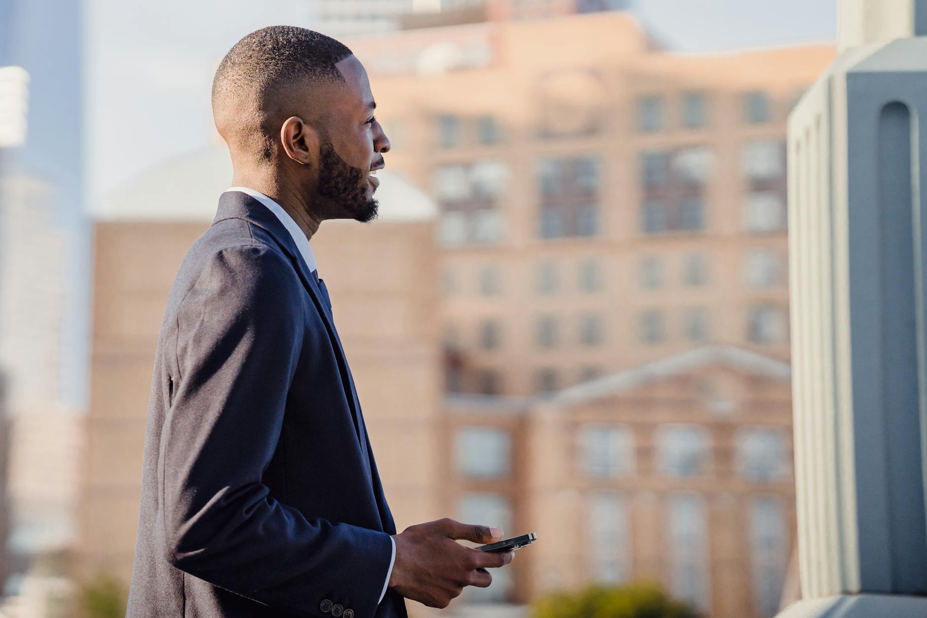 Businessman with Cellphone Outdoors